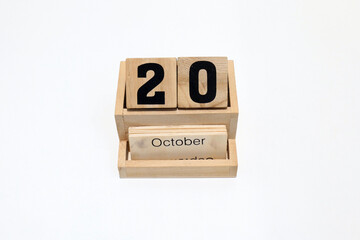 20th of October wooden perpetual calendar. Shot close up isolated on a white background 