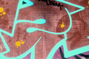 Colorful background of graffiti painting artwork with bright aerosol outlines on wall. Old school...