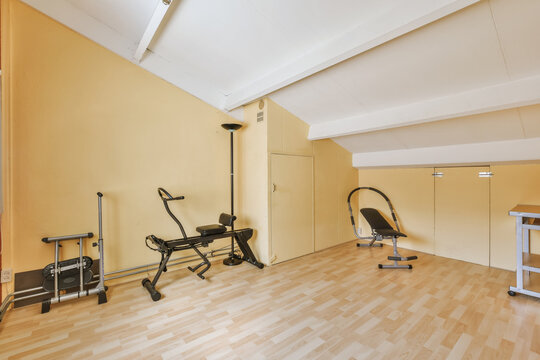 Home gym with modern exercise equipment and warm decor