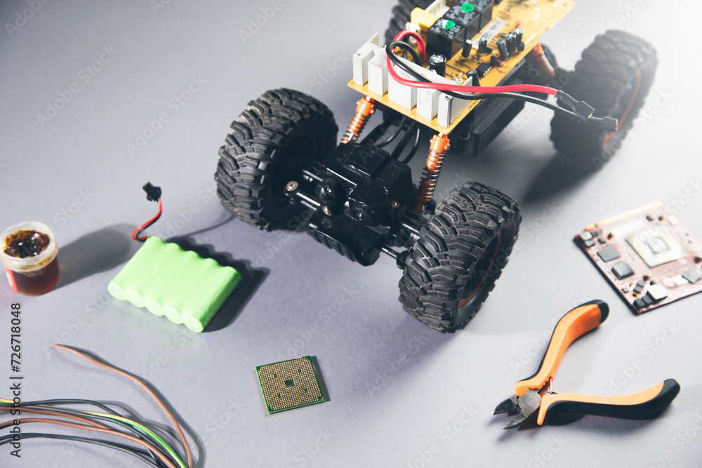 Poster a remote control car with a circuit board and wires