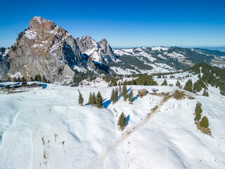 Fototapeta na wymiar Beautiful view on snowy Grosser Mythen peak in canton of Schwyz in Switzerland as seen from Rotenflue