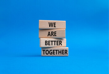 We are better together symbol. Wooden blocks with words We are better together. Beautiful blue background. We are better together concept. Copy space.