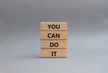 You can do it symbol. Concept words You can do it on wooden blocks. Beautiful grey background....