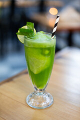 Fresh tasty lemonade with lime and mint on bar table