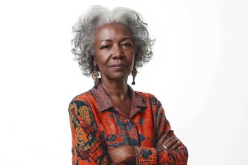 An African American woman in her 60s poses serenely on a white background, with white hair.