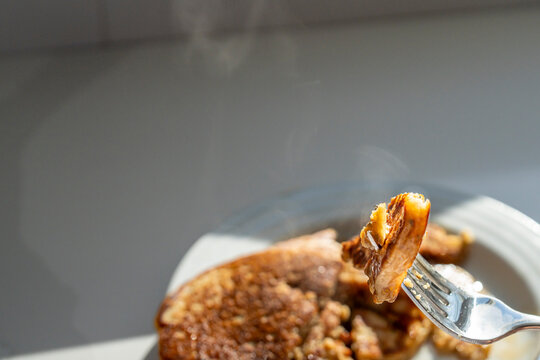 Bite of Steaming Hot Pancakes on Fork Ready to Eat