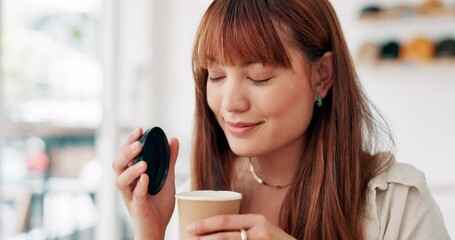 Face, smile and asian woman smelling coffee in cafe for fresh aroma with caffeine beverage to relax. Scent, drink or takeaway with happy young customer in restaurant for hospitality or service
