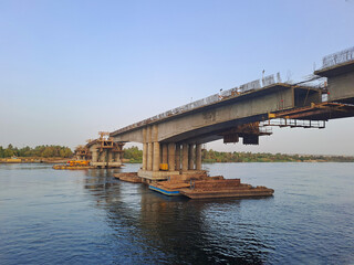 Construction of bridge under blue sky under river Nile in Egypt