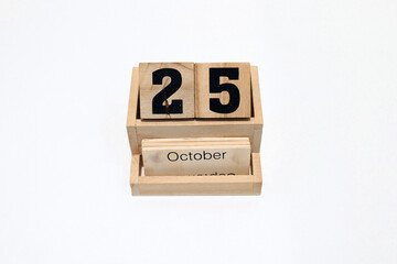 25th of October wooden perpetual calendar. Shot close up isolated on a white background 
