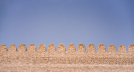 Ark Citadel with brick fortress walls in the ancient city of Bukhara in Uzbekistan on a warm summer...