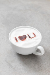 Cappuccino with the inscription cocoa on the milk foam 