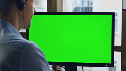 Client service mockup computer screen closeup. Chroma key green device in office