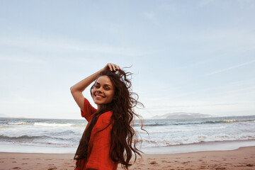 Smiling Woman Enjoying the Freedom of Summer Fun on a Sunny Beach