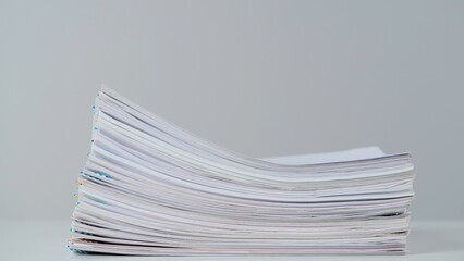 Time lapse of paper sheets on white background. Stop motion animation of business paper files...