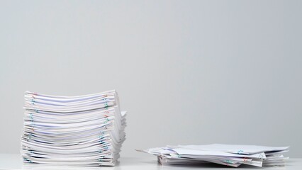 Time lapse of paper sheets on white background. Stop motion animation of one loaded stack with...