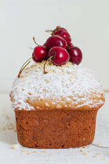 Homemade nut cake with cherrys on white background. Aesthetic breakfast concept.