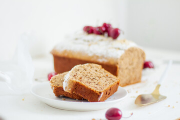 Homemade nut cake with cherrys on white background. Aesthetic breakfast concept.