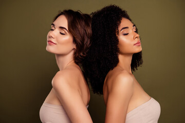 Photo of two girlfriends stand back together closed eyes and dreaming together isolated on khaki color background - obrazy, fototapety, plakaty