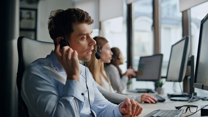 Call operator listening client in office. Friendly helpline team work together.