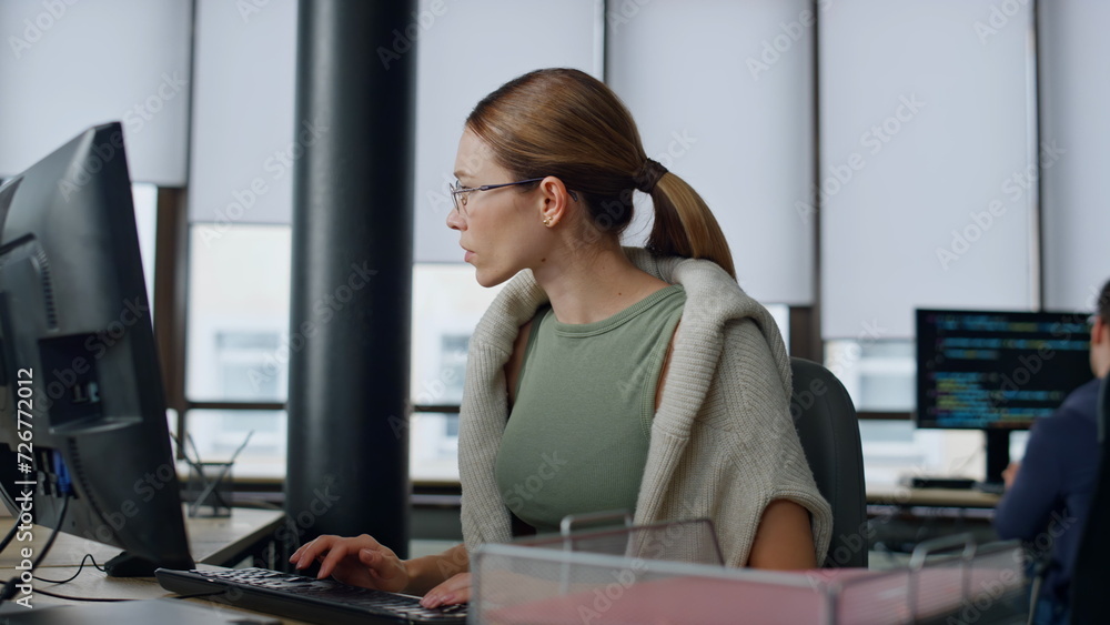 Poster software manager typing computer in office. upset woman developer solve problem