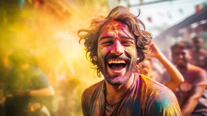 Joyful cheerful laughing caucasian man Indian street festival embodies spirit of Holi, adorned with vibrant paint surrounded by crowd. His happiness reflects the cultural richness of this celebration. - obrazy, fototapety, plakaty