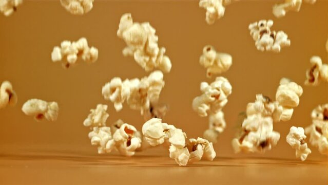 Popcorn falls on the table. Filmed on a high-speed camera at 1000 fps. High quality FullHD footage