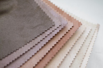 Samples of velvet tissue. Milk, beige and brown color options for velvet fabric