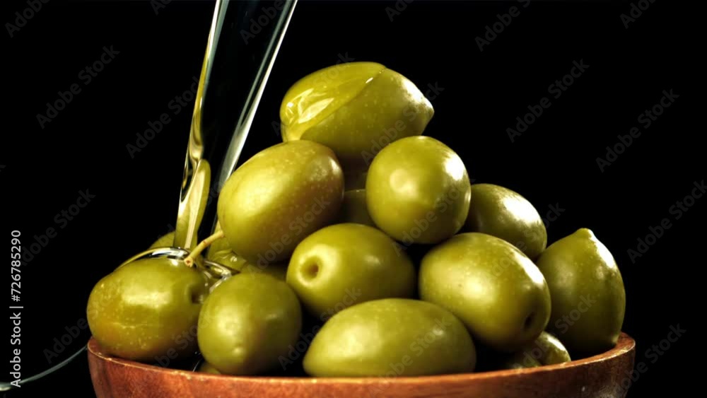 Sticker Olive oil is poured over fresh olives. Filmed on a high-speed camera at 1000 fps. High quality FullHD footage