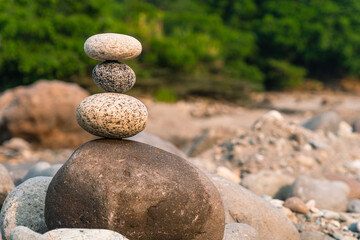Fototapeta na wymiar Art of stone balancing, meditation and concentration.