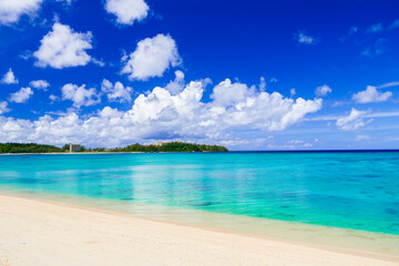 Beautiful view of tropical blue sea or ocean by the white beach and floating a cloud in summer, Okinawa in Japan, Nobody, Landscape or travel, High resolution over 50MP for wallpaper	