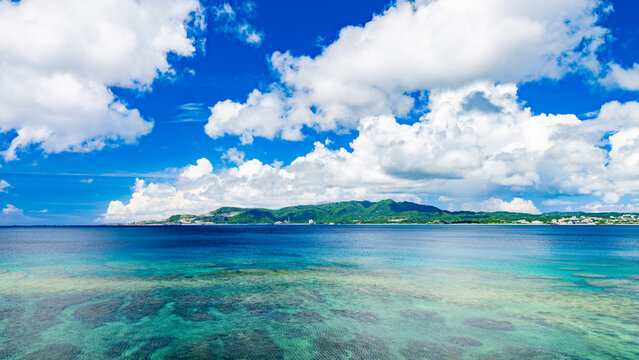 Beautiful view of tropical blue sea or ocean by the white beach and floating a cloud in summer, Okinawa in Japan, Nobody, Landscape or travel, High resolution over 50MP for wallpaper	