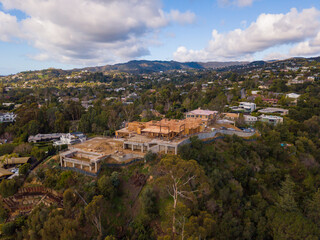 Fototapeta na wymiar Aerial views of a very large mansion, on a hilltop in the affluent Brentwood neighborhood, under construction.