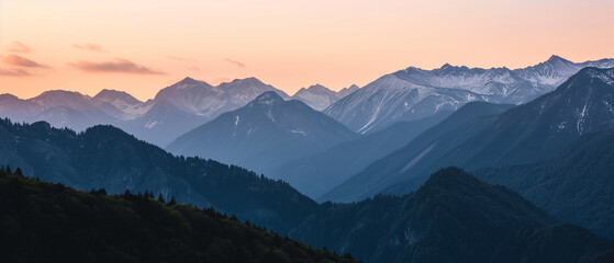 Fototapeta na wymiar Breathtaking View of Snow-Capped Peaks at Twilight: A Serene Landscape Immersed in Nature's Splendor