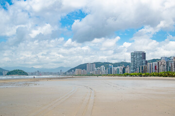 Clouds and Blue Skies Over Tropical Beach With City Skyline of Santos Sao Paolo in Brazil