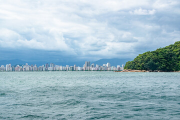 Stretching City Skyline of Santos Sao Paolo Brazil on Cloudy Day With Forest Coastline