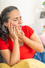 Young Woman Feeling Severe Toothache at Home