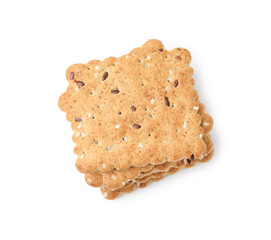 Stack of cereal crackers with flax and sesame seeds isolated on white, top view