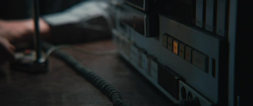 A man taking a microphone closer to himself 