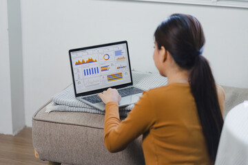 Businesswoman Analyzing Data on Laptop for Business Strategy. - obrazy, fototapety, plakaty