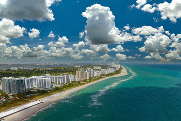 Miami Beach is popular vacation spot in southern Florida. Sandy beach surface and tourist...