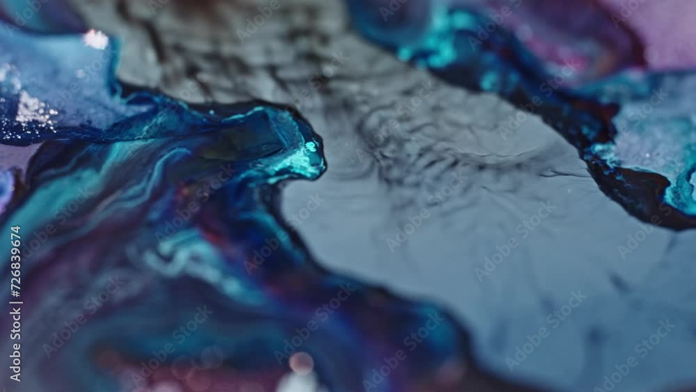 Poster close-up of swirling blue and violet inks diffusing in water, creating an abstract art effect, vibra