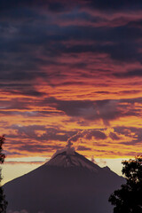 Volcano at sunset with orange clouds 