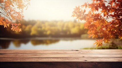 a wooden table with a blurred autumn background and a place for text. - obrazy, fototapety, plakaty