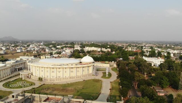 Side profile view of Indian Institute of management, Bodh Gaya during sunny afternoon in Bihar. Aerial shot.
