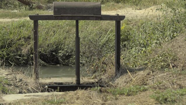 Water flow near the water lock in a irrigation canal in the Po Valley Italy.