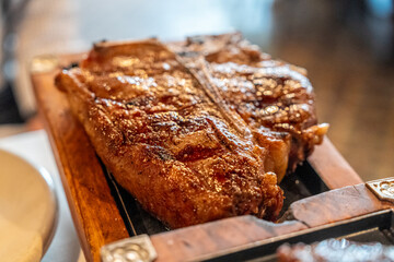 grilled steak on wooden table