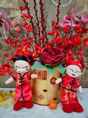 Two traditional Chinese dolls for Chinese New Year decoration. Selective focus