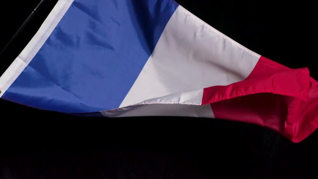 French national flag on dark background 