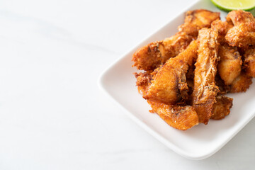 Fried Snapper Belly on white plate