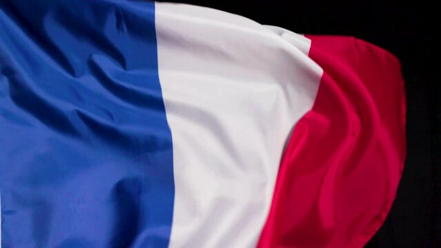 French national flag on dark background 